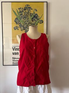 Vintage red vest. 100% cotton. Has buttons all down the front. No damage. Size Small. NO RETURNS. Cotton Button-up Vest, Cotton Button-up Vest With Buttons, Cotton Button-up Vest Top, Red Cotton Vest Tank Top, Red Cotton Vest Top, Red Cotton Casual Vest, Casual Red Cotton Vest, Red Summer Tops With Pockets, Casual Red Cotton Tank Top