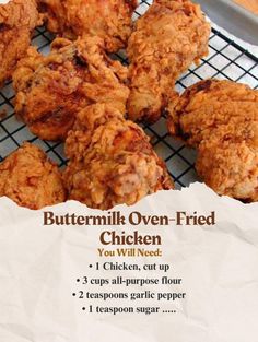 a bunch of fried chicken sitting on top of a cooling rack