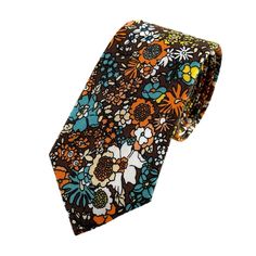 This Fun And Funky Handcrafted Tie Is A Perfect Accessory To Spruce Up Your Outfits This Summer! Wear It To Events And Parties Through Fall Or To A Retro-Theme Wedding For Non-Stop Compliments! Fabric: 100% Cotton Style: Slim/Narrow Width Approx. (W) 2.5 In. X (L) 58 In. Care: Dry Clean Only Thank You! Tags: Fashion, Gentleman, Groom, Groomsman, Best Man, Father’s Day, Anniversary, 70s, Vintage, Rustic, Whimsical, Hipster, Sprezza, Sprezzatura, Gq Style, Casual, Skinny, Narrow, Dad, Handmade Blue Necktie, Floral Necktie, B 12, Gq Style, Groomsman Gift, Men Cream, Floral Pocket, Retro Theme, Tie Styles