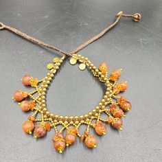 The Beautiful Hand Made Knotted Brass and Old Antique Indo Tibetan Carnelian Beads Necklace Very Beautiful Hand Made Necklace Fast and Free Shipping World Wide Adjustable Orange Artisan Necklace, Artisan Adjustable Orange Necklace, Artisan Orange Adjustable Necklace, Bohemian Orange Beads For Jewelry Making, Bohemian Orange Beaded Necklaces For Jewelry Making, Orange Bohemian Beaded Necklaces For Jewelry Making, Handmade Orange Agate Beaded Bracelets, Orange Beaded Bohemian Choker, Amber Jewelry With Dangling Round Beads