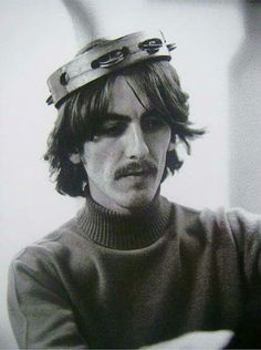 black and white photograph of a man wearing a hat