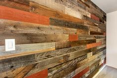 a wall made out of wooden planks in a room