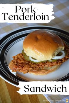 there is a sandwich on a plate with the words pork tenderion above it and below it