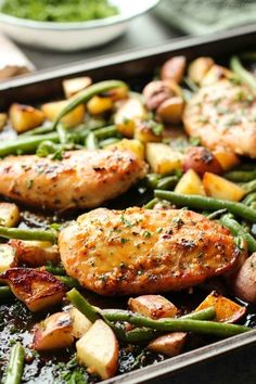 chicken, potatoes and green beans in a skillet