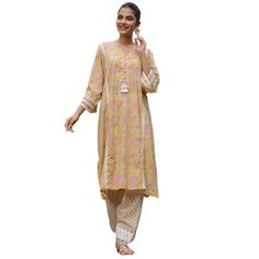 Our Afghani style chogha sets are as comfortable as they are beautiful! Designed to be free flowing and loose, this set is crafted in our signature block print cotton and comes with a top and salwar. Gorgeous tassel, lace, and shell details add interest and elevate this effortless look. This item is free size. One size fits most S-XXL. This item ships directly from Jaipur at no extra cost. Bohemian Mulmul Anarkali Set With Floral Print, Bohemian Anarkali Set With Straight Kurta For Spring, Bohemian Anarkali Set With Printed Motifs For Summer, Spring Bohemian Anarkali Set With Straight Kurta, Bohemian Mulmul Sets With Floral Print, Bohemian Floral Print Sets In Mulmul, Bohemian Sets With Floral Print, Bohemian Mulmul Salwar Kameez For Spring, Cotton Sets With Chikankari Embroidery Tunic