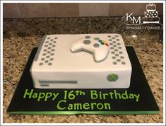 a birthday cake made to look like a video game controller