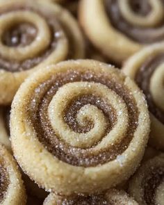 closeup of cinnamon rolls with sugar on top and brown icing in the middle