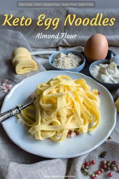 the cover of keto egg noodles by almond flour, eggs and other ingredients on a table