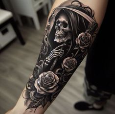 a woman's arm with a skeleton and roses tattoo design on it, in black and white