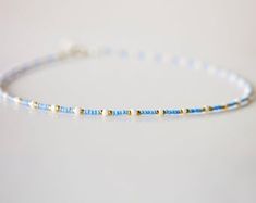 The Classic surfer necklace has select sizes available with an adjustable 2-inch extender chain to comfortably fit any size neck. made of czech sea blue seed beads with white and black glass seed beads. Perfect for layering with other necklaces or chokers and great to wear with any outfit. It is made for any look you want; a cute choker or a collarbone necklace. It is carefully crafted to ensure durability so you can wear it everyday! Seed Bead Necklaces, Collarbone Necklace, Surfer Necklace, Bead Necklaces, Layer Necklace, Necklace Blue, Seed Bead Necklace, Sea Blue, Necklaces For Women