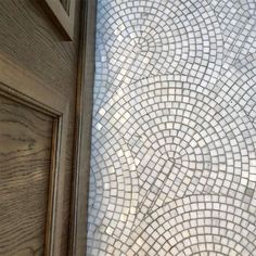 an open door with a glass mosaic design on it