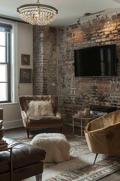 a living room filled with furniture and a flat screen tv mounted to the side of a brick wall