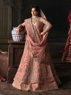 a woman in a pink bridal outfit