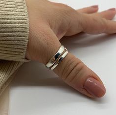 🌟 Elevate Your Style with a Silver Double Layer Ring! 🌟 Introducing our stunning Silver Double Layer Ring, a statement piece that combines elegance and versatility. 🌿 Unique Double Layer Design: This ring features a distinctive double-layered band that adds depth and texture to your look. The adjustable design ensures a comfortable fit, making it perfect for daily wear. 💍 Silver Jewelry for Women: Crafted with high-quality silver, this ring isn't just an accessory - it's a symbol of timeless Adjustable Thick Band Midi Rings As Gift, Adjustable Stackable Wide Band Ring For Everyday, Adjustable Wide Band Ring For Everyday, Adjustable Wide Band Ring As Gift, Silver Thumb Rings For Women, Silver Thumb Rings, Thumb Rings For Women, Thumb Rings Silver, Layered Rings