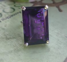 WELCOME TO                GEMSnJEWELRYGALLERY We offer you a broad variety of loose gemstones and exclusive jewellery pieces on best prices. Main Stone:  Natural Amethyst Stone Size: 20×30mm Stone Shape:Emerald Cut Material:Solid Silver Finish With Rhodium Customer Satisfaction is our Top Most priority. "Note:Gemstone is Natural not lab Grown. Metal: 925 Silver (Solid 10K/14K/18K White Gold/Yellow Gold/Rose Gold) available to customize,plz feel free to contact us. Ring Size: We usually offer US Formal Polished Amethyst Gemstones, Polished Amethyst Gemstones For Formal Occasions, Purple Polished Gemstones Fine Jewelry, Purple Gemstones With Polished Finish Fine Jewelry, Purple Polished Gemstones For Fine Jewelry, Formal Amethyst Ring With Large Stone, Formal Octagon Amethyst Ring, Large Stone Gemstones For Formal Occasions, Octagon-shaped Amethyst Ring For Formal Occasions