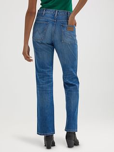 This bold take on our iconic bootcut offers everything the modern cowgirl could want, including a mid-rise waist, a fitted silhouette through the seat, a straight leg through the knee, as well as a perfectly flared leg opening your boots will love. It comes fully loaded with all the Wrangler® icons you know and want: the five-pocket styling, the “W” embroidery, a logo patch, and branded hardware to round out the look. Trust us, these jeans were made for walking. Western Style Straight Leg Flare Jeans In Medium Wash, Straight Leg Bottoms For Rodeo, Dutch Netherlands, Modern Cowgirl, Wrangler Jeans, Fitted Silhouette, Patch Logo, The Knee, The Modern