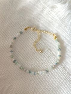 FOR OTHER DAINTY BEADED BRACELETS: https://www.etsy.com/ca/shop/ArtiChouXCanada?ref=seller-platform-mcnav§ion_id=46088511 Bracelet Length: 13-18cm (5.1-7 inches) with a 14k gold filled extender.  This bracelet features an assortment of pastel colors: white, gray and different shades of green Japanese seed beads.  Thread may be visible since it is a handmade product   SIZING  Wrap a soft measuring tape snugly around the widest part of your wrist. Add 1.27cm (0.5in) to that measurement to determin Dainty Handmade Crystal Bracelet With Round Beads, Delicate Adjustable Beaded Crystal Bracelet, Delicate Beaded Crystal Bracelet With Round Beads, Delicate Handmade Friendship Bracelets, Delicate Handmade Beaded Friendship Bracelets, Delicate Handmade Friendship Bracelets With Round Beads, Green Beaded Bracelets, Colorful Bracelet, Different Shades Of Green