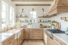 a kitchen with wooden cabinets and white counter tops, along with open shelves on the wall