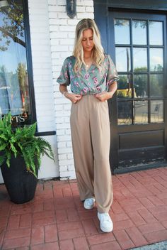 Get ready to up your fashion game with the Dress Code Trouser Pant! This tan pant features a comfortable elastic waistband and invisible zipper closure. Dress it up or down, these pants are perfect for any occasion. Say goodbye to uncomfortable trousers and hello to style and comfort! Spring Business Casual Khaki Bottoms, Spring Khaki Bottoms For Business Casual, Chic Khaki Wide Leg Pants With Elastic Waistband, Chic Taupe Pants For Spring, Casual Taupe Pants For Workwear, Casual Taupe Workwear Pants, Neutral Pants With Elastic Waistband For Day Out, Business Casual Beige Pants With Elastic Waistband, Beige Pants With Elastic Waistband For Business Casual