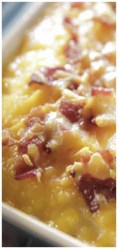 a casserole dish with bacon and cheese in it