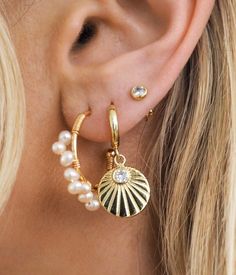 Description - Elevate your style this summer with our new Sunburst Hoops. These unique bold hoops go with every summer outfit, making them a staple in your jewelry collection. From a bikini on the beach to a flowy dress with sandals, dress them up or down with ease all summer long. Premium Copper + 18k gold PVD coating Hoop width ~ 10mm Water-Resistant Hypoallergenic Gift ready packaging Free stickers Bohemian Jewelry For Summer Beach Party, Adjustable Hoop Jewelry For Summer, Chic Spring Vacation Jewelry, Trendy Gold Jewelry For Summer, Elegant Summer Vacation Jewelry, Adjustable Summer Jewelry For Beach, Adjustable Summer Vacation Jewelry, Beachy Everyday Summer Jewelry, Summer Festival Jewelry For Beach Season