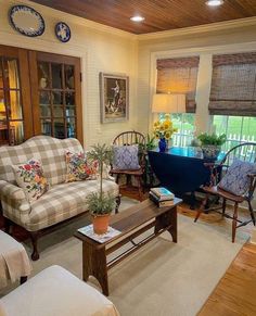 a living room filled with furniture and decor