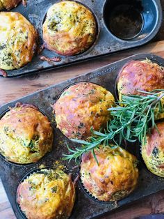 several muffins with herbs in them sitting on a baking tray next to a cupcake tin