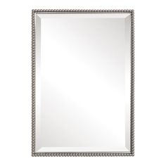 a silver framed mirror on a white wall with beaded border around the edges and bottom edge