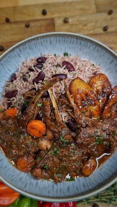 a blue plate topped with meat and rice