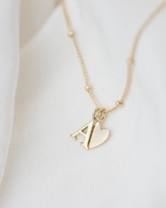 Personalized 14k solid gold initials necklace with beautiful beaded chain. Simple, minimalist everyday necklace.Perfect wearing alone or layering with your favorite necklaces. Each initial measures approx. 7mm You can add up to 5 Initials (Heart counts as ONE initial ) 16" or 18" Bead Chain 14k Gold * Leave us your initials and placement in the comment box at checkout. Tiny Diamond Necklace, Initials Necklace, Gold Initial Necklace, Jewelry Accessories Ideas, Initial Necklace Gold, Initial Jewelry, Everyday Necklace, Gold Initial, Bead Chain