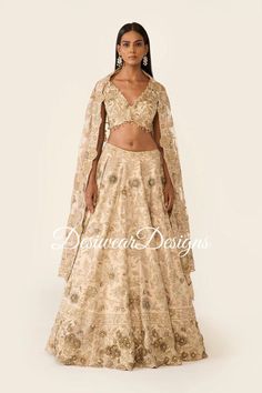 Made to Order/Measurement/Custom Order Lehenga - Color : off white - Fabric : Embroidered  tishu silk - Fully flared paneled lehenga - Embroidered  Blouse -  Net Dupatta with Gold Border - Drawstring closure with Tassels - - It can be customize in any design or size  PLEASE NOTE: BUYERS ARE RESPONSIBLE FOR ANY CUSTOMS AND IMPORT TAXES THAT MAY APPLY. This is a made to order product. If you opt for 'Made To Measurement Option', we will provide a measurement template and you can share the measurements likewise. If you want to opt for 'Standard Size', Please refer to the size chart provided in the listing. Shipping: Standard Shipping is done by DHL ecommerce and it mostly takes 2 to 3 weeks to deliver after dispatch. Express Shipping is done by DHL express and it mostly delivers within a week Elegant Off White Festive Gown, Elegant Off-white Festive Gown, Elegant Raw Silk Lehenga For Festive Occasions, Elegant Festive Raw Silk Lehenga, Elegant Beige Traditional Wear With Zari Work, Elegant Choli For Reception, Elegant Beige Choli With Traditional Drape, Elegant Off White Gown For Festive Occasions, Fitted Sets With Traditional Drape In Elegant Style