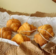 four croissants wrapped in twine and tied with string