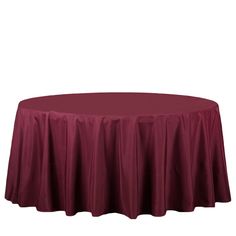 a round table with a red cloth on it