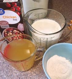 ingredients to make an apple pie sitting on a counter next to a glass measuring cup