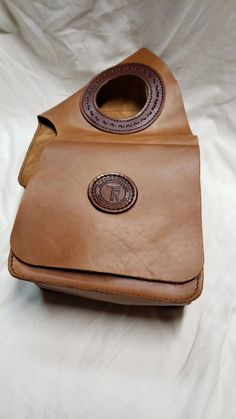 "The Bavaria Saddle Horn Bag by TPar LeatherWork's is hand made, from 100% full grain leather. It is 4/5 oz. leather, that has been oiled. It is soft and flexible and very durable, grate leather for Saddle Bags. Definitely a low maintenance leather. Like all the products we make, it has been made well and made to last a lifetime. Easily attaches to your saddle, just drop it over the horn, and you're ready to go. It has two Dee rings, one on either side, makes it possible to tie it down. It has S Classic Leather Pouch With Soft Leather, Leather Belt Bag With Coin Pocket For Daily Use, Classic Soft Leather Pouch, Everyday Leather Shoulder Bag With Patch, Leather Hand Tooled Saddle Bag For Daily Use, Leather Saddle Bag With Leather Lining, Brown Leather Belt Bag With Coin Pocket, Leather Pouch With Coin Pocket For Everyday Carry, Classic Brown Leather Pouch