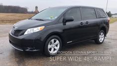 a black toyota sienna is parked in a lot with the words super wide - 48 ramp