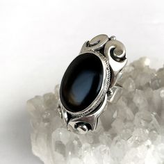 Large onyx ring sterling silver, black gemstone ring goth ring Black crystal ring made in Armenia gifts for women Handmade silver ring with natural black onyx. The ring is large and has a unique look! The free size of this ring lets you give a gift without knowing the size of finger) Also, All our pieces have the perfect design, modern look, and best quality ▶Ring weight: 18.53 gr ▶Length: 45 mm ▶Width: 25 mm All our jewelry is made of high-quality sterling silver and is stamped with a 925 stamp Gothic Sterling Silver Crystal Ring As Gift, Gothic Sterling Silver Crystal Ring For Gift, Gothic Silver Crystal Ring With Gemstone, Gothic Style Silver Ring With Gemstone, Gothic Silver Ring With Gemstone, Gothic Sterling Silver Open Ring Jewelry, Gothic Sterling Silver Open Ring, Gothic Gemstone Rings With Oval Shape, Black Oval Gothic Jewelry