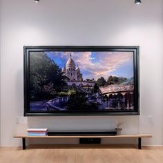 a large television mounted to the side of a wall