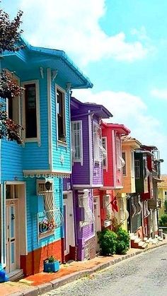 a row of houses painted in different colors