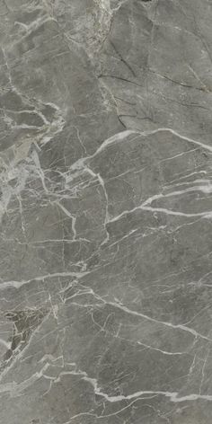 a gray marble textured surface with white lines and grey veining on the edges