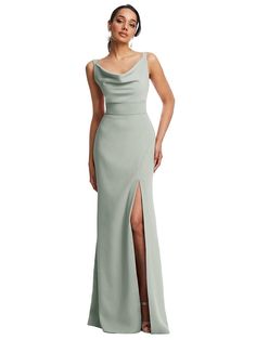 a woman in a long dress with a slit on the side