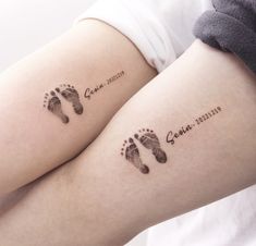 two tattoos on the legs of people who are both showing their baby's footprints