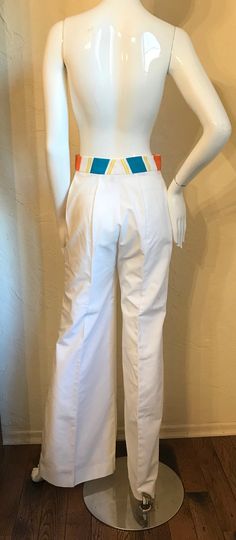 "Wow....1970's Mod pants suit - tagged Strawberry Plant California by Dorothy Schoelen. Here is a great set In a cotton blend broadcloth fabric. The jacket has the bright stripes in an open style with short cuffed Sleeves, patch pockets and has the contrasting top stitching. The pants are a high waist wide leg style and have the stripe waistband and orange contrasting top stitching with a front nylon zipper. Both in great condition. Tagged a size 7/8. measurements lying flat: Jacket - Bust 19\", Tailored Cotton Pants For Spring, Retro Cotton Bottoms For Workwear, Retro Stretch Cotton Pants, Retro Fitted Cotton Pants, White Cotton Retro Bottoms, Retro Cotton Pants For Work, Retro Cotton Pants With Belt Loops, White Retro Stretch Pants, Retro White Stretch Pants