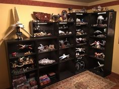 a collection of star wars action figures on shelves