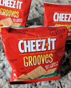 three cheez it crackers sitting on top of a counter