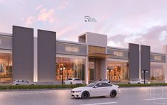 a white car is parked in front of a retail store with cars on the street