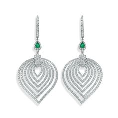 Crafted in 18K white gold, these earrings are pave set with 518 round brilliant cut diamonds. There's a pear shape emerald set that's fixed to the hoop. Elegant Teardrop Diamond Earrings Fine Jewelry, Teardrop Diamond Earrings With Elegant Design, Diamond White Brilliant Cut Teardrop Earrings, Diamond White Teardrop Earrings With Brilliant Cut, Luxury Pear-shaped Gemstone Diamond Earrings, Luxury Pear-shaped Diamond Earrings With Gemstones, White Gold Diamond-cut Teardrop Earrings, White Gold Diamond Cut Teardrop Earrings, White Gold Teardrop Earrings With Prong Setting