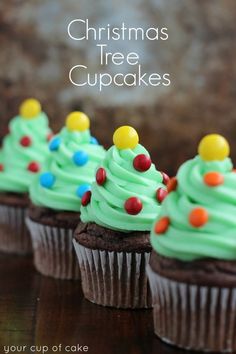 christmas tree cupcakes with green frosting and sprinkles on top