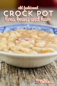 an old fashioned crock pot with beans and ham in it on a blue and white plate