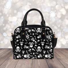 This stylish Goth purse features a cute skulls pattern that blends perfectly with its black and white color scheme, making it a perfect accessory for any alternative outfit. The handbag is made of high-quality materials and has a spacious interior, perfect for carrying all your essentials. The purse is designed with sturdy straps, making it comfortable to carry even when fully packed. Perfect for fans of goth fashion, this unique handbag is a must-have in your collection. ► ABOUT THIS PURSE Colo Goth Purse, Gothic Mode, Unique Handbag, Bowler Bag, Gothic Accessories, White Handbag, Purse Styles, Skull And Crossbones, Alternative Outfits